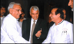 Chef Davinder Kumar is being introduced to former Chief Minister of Haryana, Mr Hooda at Chef Awards function.