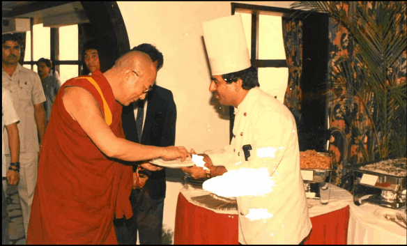 Chef Kumar welcoming H.H. Dalai Lama over a lunch, Special Menu was prepared in his honour.